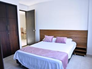 Postel nebo postele na pokoji v ubytování Hotel Iguaraya Inn