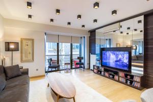 Телевизор и/или развлекательный центр в Deger 16 Residences