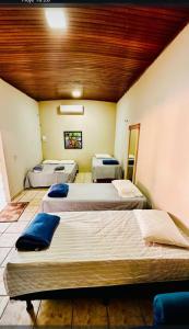 a room with three beds in a room at Residencial Celedone in Boa Vista +45 photos