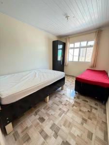 Ένα ή περισσότερα κρεβάτια σε δωμάτιο στο Casa com Piscina em Pontal do Sul +18 φωτογραφίες