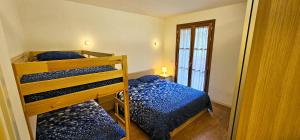 Postel nebo postele na pokoji v ubytování Bilocale nel Resort con terrazzo - Val di Luce + 27 fotografií