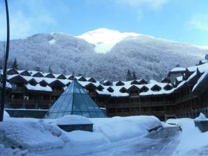 Bilocale nel Resort con terrazzo - Val di Luce v zimě