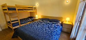 Postel nebo postele na pokoji v ubytování Bilocale nel Resort con terrazzo - Val di Luce