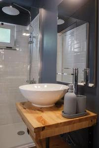 a bathroom with a white sink and a shower at BABhouse Villa Jardim das Laranjeiras in Nagoselo do Douro +24 photos