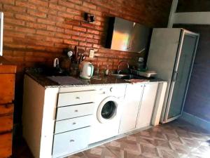 Kuchyň nebo kuchyňský kout v ubytování Casa quincho don Octavio + 3 fotografie