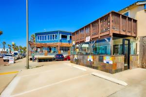 a building with a balcony on the side of a street at OB Pier 1 in San Diego