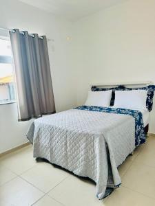 Una cama o camas en una habitación de Casa brisa do mar