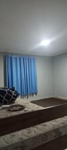 Ένα ή περισσότερα κρεβάτια σε δωμάτιο στο Casa de 2 Quartos em Cabo Frio +5 φωτογραφίες