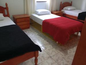 Triana Guest House客房内的一张或多张床位