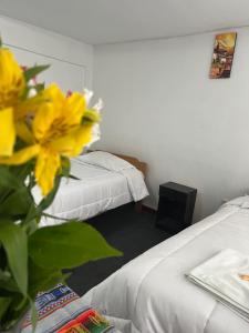 Llit o llits en una habitació de ENEDE HOSTEL
