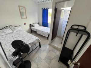 Hotel Mariu Melgar客房内的一张或多张床位