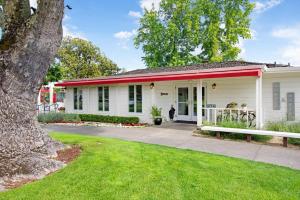 a white house with a red roof at Silverado Condo in Napa