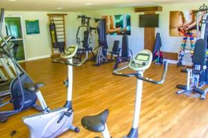 a gym with several exercise bikes in a room at Fortaleza VG Fun Flats Sol e Mar in Fortaleza