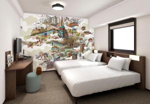 Un ou plusieurs lits dans un hébergement de l'établissement Garner Hotel Osaka Honmachi Midosuji by IHG