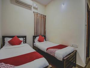 Hotel O Grand Brundavan客房内的一张或多张床位
