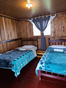 Postel nebo postele na pokoji v ubytování Hostal Pachanuna