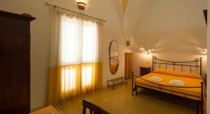A bed or beds in a room at B&B La Garolla