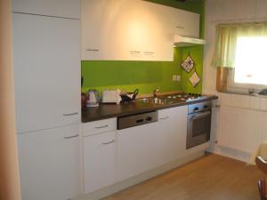 Kuchyň nebo kuchyňský kout v ubytování Appartements Schusser