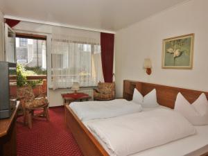 Voodi või voodid majutusasutuse Schwarzwaldgasthof Hotel Schwanen toas