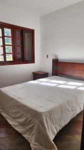 a bedroom with a large bed in a room at Recanto Itapeva Garden in Itapeva +15 photos