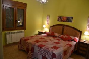 Postel nebo postele na pokoji v ubytování Apartamentos Rurales Natura