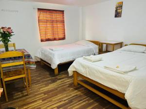 Llit o llits en una habitació de ENEDE HOSTEL