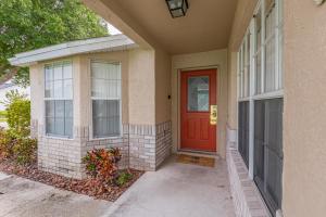 a house with a red door on a street at Safari Lodge in Orlando