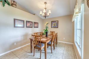 a dining room with a wooden table and chairs at Safari Lodge in Orlando
