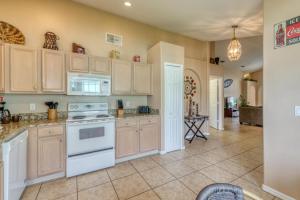 a kitchen with a white stove top oven at Safari Lodge in Orlando