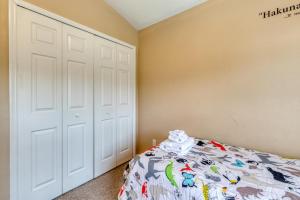 a bedroom with a white closet and a bed at Safari Lodge in Orlando