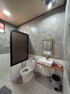 a bathroom with a toilet and a sink at Him Doi Villa ฮิมดอยวิลล่า in Ban Na Kham +40 photos