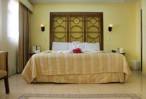 Кровать или кровати в номере Hotel Residencial