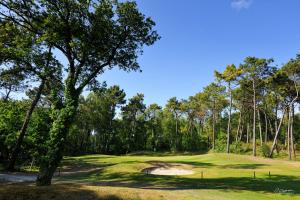 a view of a green at a golf course at Hôtel Barrière Le Westminster in Le Touquet-Paris-Plage