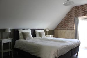 Postel nebo postele na pokoji v ubytování B&B de Rijcke Rust