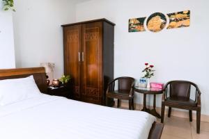 Llit o llits en una habitació de Lotus Rock Hotel Đà Nẵng