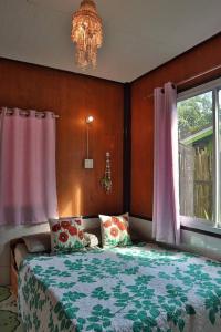 Postel nebo postele na pokoji v ubytování Small Guest House Koh Kood