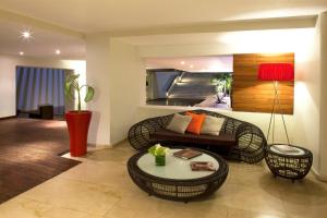 a living room with a couch and a table at Emporio Mazatlan in Mazatlán