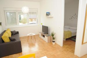 Televízia a/alebo spoločenská miestnosť v ubytovaní Amaros Apartment