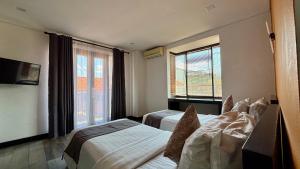 TV a/nebo společenská místnost v ubytování Hotel ARA Legian