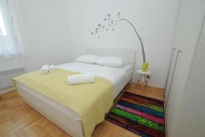 Posteľ alebo postele v izbe v ubytovaní Amaros Apartment