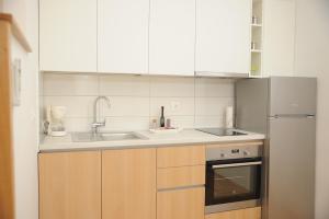 Kuchyňa alebo kuchynka v ubytovaní Amaros Apartment