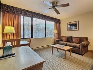 a living room with a couch and a table at 1bd 272 Perfect Location with Pool in Crested Butte