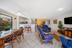 a living room with a table and chairs at Unit 10 Marcoola Beach Resort in Marcoola