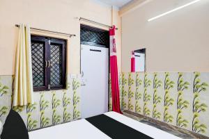 Postel nebo postele na pokoji v ubytování Hotel O Gautam + 21 fotografií