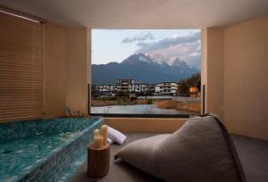 Kuvagallerian kuva majoituspaikasta 云渡雪山湖景民宿 Vento Snow Mountain Lake View B&B, joka sijaitsee kohteessa Lijiang