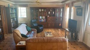 a living room with a couch and a chair at Casa Hontoba in Hontoba