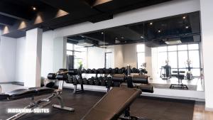 a gym with a lot of equipment in a room at Harmony Luxury Suites At TM Persiaran Stonor KLCC in Kuala Lumpur