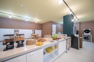Kuchyň nebo kuchyňský kout v ubytování Elegance hotel hwangridan