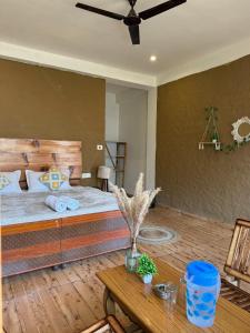 A bed or beds in a room at The VOID - Tirthan Valley