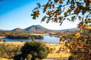 a view of a lake with mountains in the background at Award-winning A-frame Chalet W Cedar Tub & Views in Julian